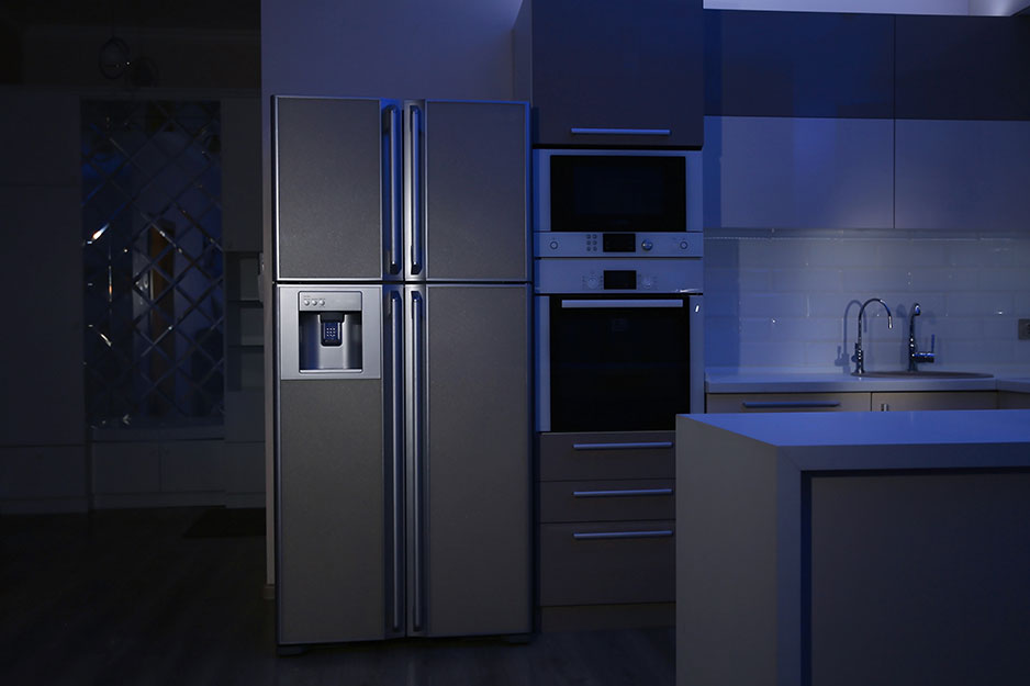 A refrigerator in a kitchen during a power outage.